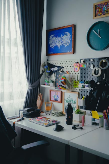 Minimalist desk setup with artwork and warm light